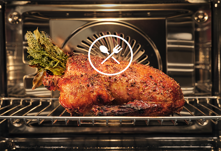 Meat cooking in oven