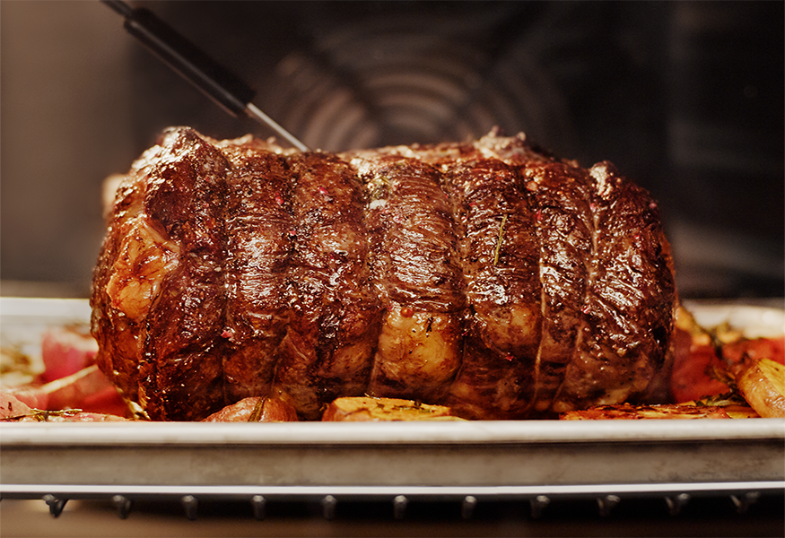 Leg of lamb roasting in oven