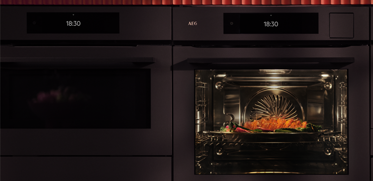 Oven with light on and pumpkin cooking
