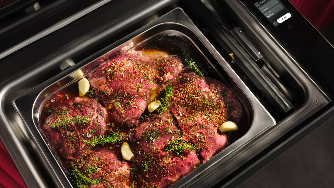 Meat marinating with herbs and spices